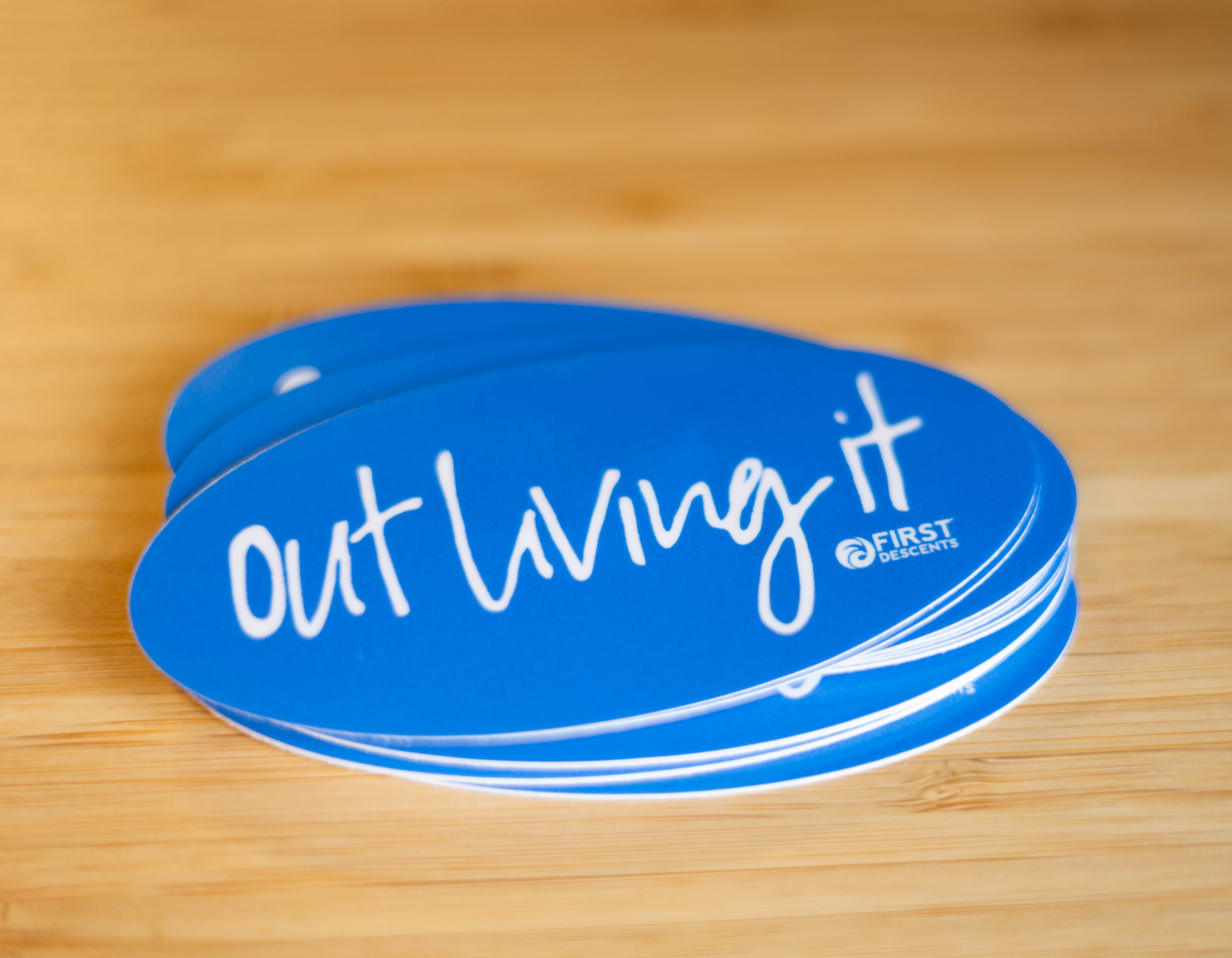 Out Living It Sticker – First Descents Shop